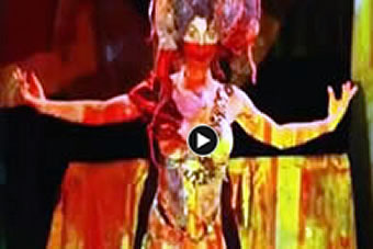 A photograph of the exterior of the Mann Island complex which features two giant black buildings and the word 'Discover' written above the door.